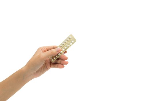 Woman hand taking birth control pills. Asian adult woman holding pack of contraceptive pills isolated on white background with clipping path. Choosing family planning with birth control pills concept