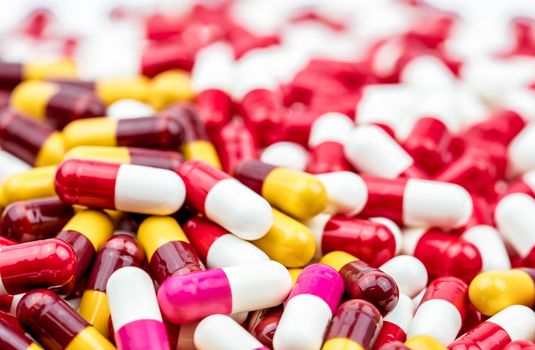 Selective focus on colorful of antibiotic capsules pills on blur background with copy space. Drug resistance concept. Antibiotics drug use with reasonable and global healthcare concept. Pharmaceutical industry. Pharmacy background.