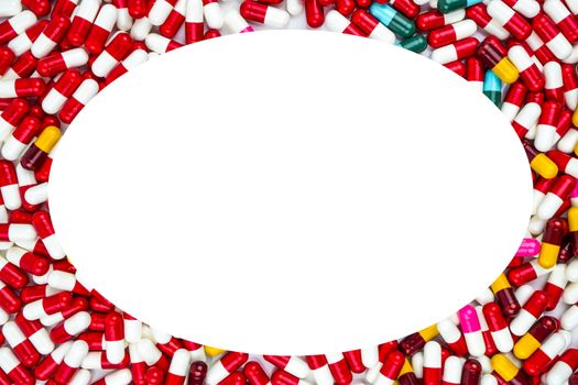 Colorful of antibiotics capsule pills oval frame on white background with copy space. Drug resistance concept. Antibiotics drug use with reasonable and global healthcare concept. Pharmaceutical industry. Pharmacy background.