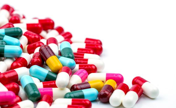 Selective focus of antibiotic capsules pills on blur background with copy space. Drug resistance concept. Antibiotics drug use with reasonable and global healthcare concept. Pharmaceutical industry. Pharmacy background.