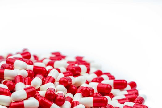 Selective focus of antibiotic capsules pills on white background with copy space. Drug resistance concept. Antibiotics drug use with reasonable and global healthcare concept. Pharmaceutical industry. Pharmacy background. Health budgets and policy.