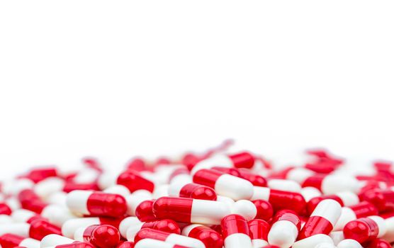 Selective focus of antibiotic capsules pills on white background with copy space. Antimicrobial drug resistance concept. Antibiotics drug use with reasonable and global healthcare concept. Pharmaceutical industry. Pharmacy background.