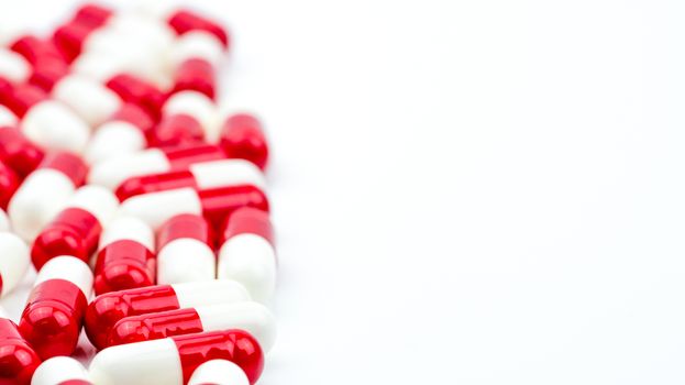 Selective focus of antibiotic capsules pills on white background with copy space. Antimicrobial drug resistance concept. Antibiotics drug use with reasonable and global healthcare concept. Pharmaceutical industry. Pharmacy background.