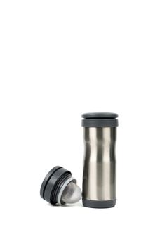 Silver thermos bottle with opened cap on white background with copy space