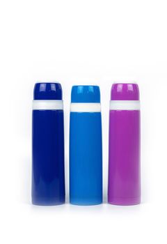 Blue and purple thermos bottle isolated on white background with copy space