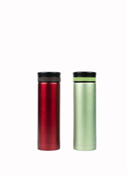 Red and green thermos bottle isolated on white background with copy space