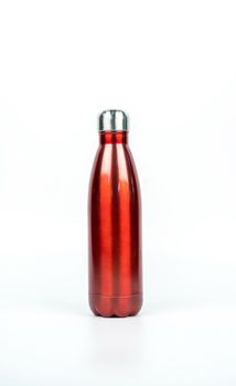 Red thermos bottle with sport design isolated on white background with copy space. Beverage container. Coffee and tea bottle.