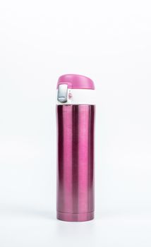 Pink thermos bottle isolated on white background with copy space. Beverage container. Coffee and tea bottle.