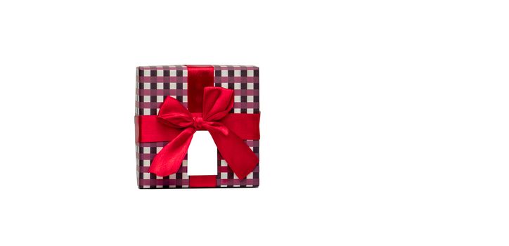 Plaid pattern gift box with red ribbon bow and blank greeting card isolated on white background with copy space, just add your own text. Use for Christmas and new year festival