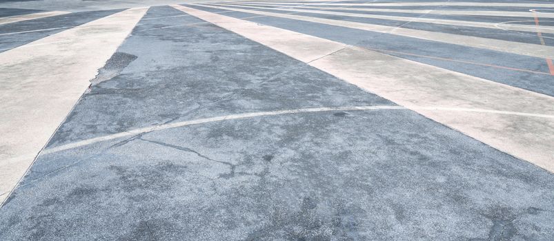 Texture of asphalt road surface with white traffic strip