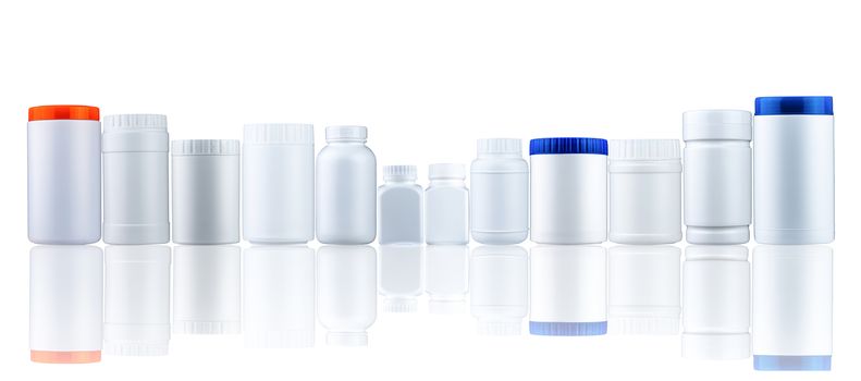 Plastic drug bottle container with closed cap. Pharmaceutical industry packaging. Many of medicine bottle with different size and shape with blank label isolated on white background.