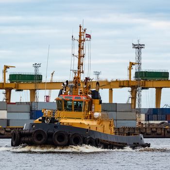 Tug ship in the cargo port of Riga, Europe