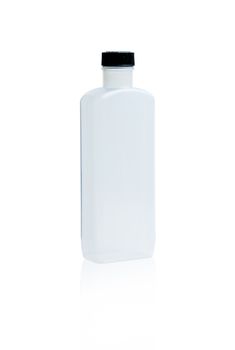 White medicine bottle with black cap and blank label isolated on white background with copy space. PET (Polyethylene terephthalate) plastic bottle container use in pharmaceutical industry packaging.