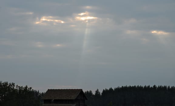 Stream of light cut through clouds and beam blockhouse