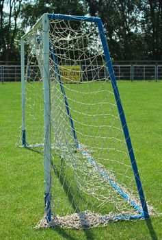 Goal gate on football field, side view