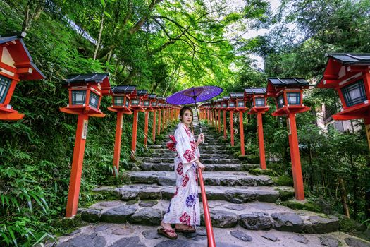 Asian woman wearing japanese traditional kimono at  Kifune Shrine in Kyoto, Japan.