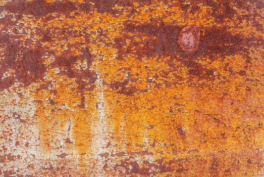 rusty iron surface covered with old chipped grey color paint, which has long been influenced by different climatic conditions