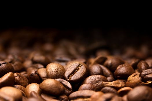 Coffee beans. Dark background with copy space, close-up