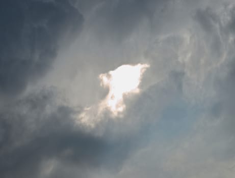 Bright part of sky surrounded by clouds