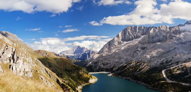 Fedaia lake in Dolomites with view of Marmolada mountain