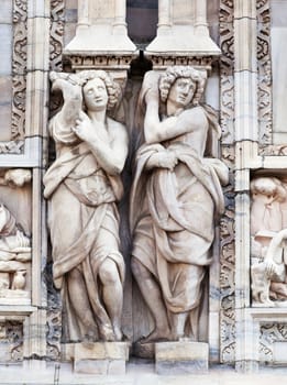 Statue on the wall of cathedral in Milan, Italy