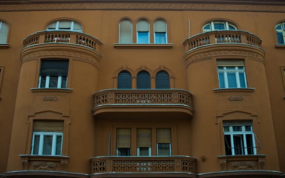 Urban building exterior with windows and balcony