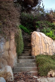 Stone steps leading into an alcove found on a California beach along the coastline