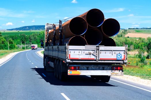 Picture of big truck with the trailer moves on the highway