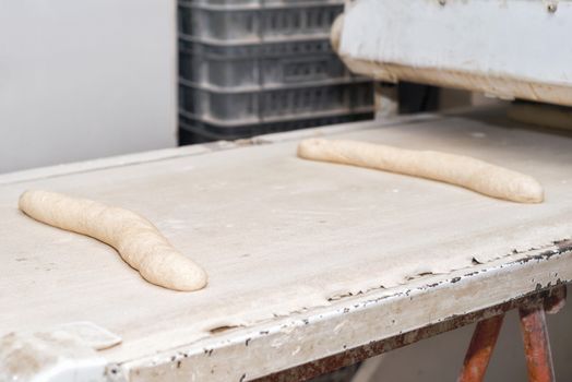 uncooked bread dough loaves ready to bake in industrial bakery