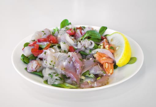 Ceviche - raw fish and seafood - marinated in lemon juice