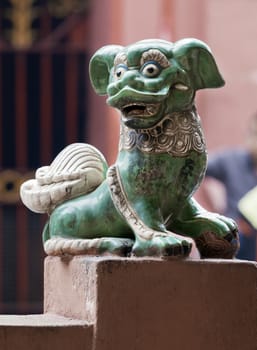 Marble lion at the entrance of a temple, Vietnam