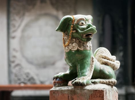 Marble lion at the entrance of a temple, Vietnam