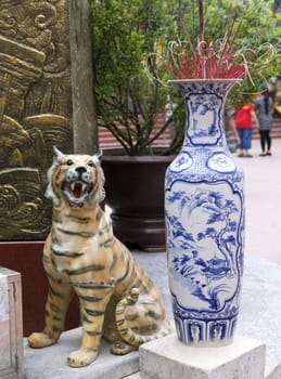 Traditional Chinese blue-and-white ceramic incense burner at the entrance of a temple