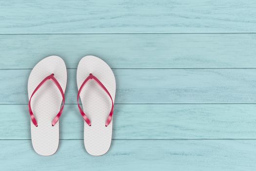 White flip flops on wooden floor, top view