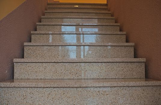 Modern marble stairs inside of a building going up