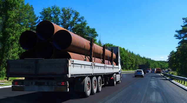 Picture of big truck with the trailer moves on the highway