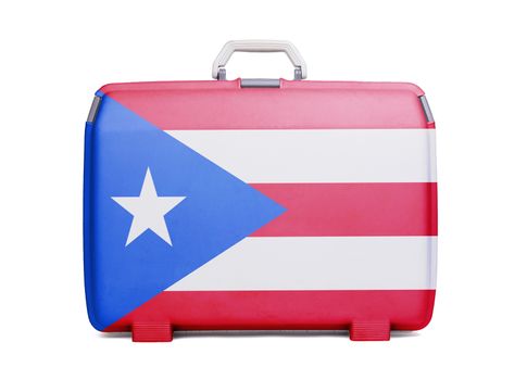 Used plastic suitcase with stains and scratches, printed with flag, Puerto Rico
