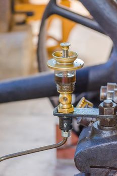 Close up of a steam engine Detail here in the picture Oil level gauge