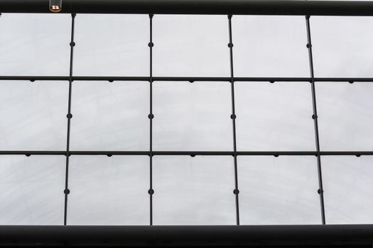 Modern office building with glass facade as a background.