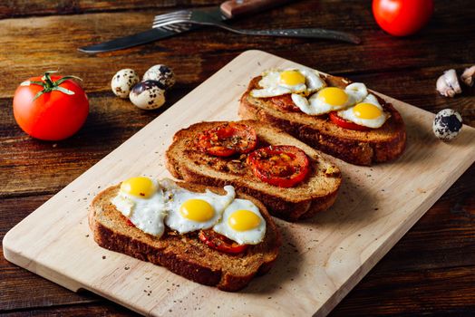 Three Toasts with Quail Eggs and Tomatoes