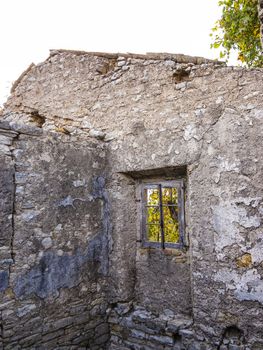 Old abandoned stone-built house in Old Perithia at Pantokrator Mountain, Corfu Island, Greece. Old Perithia is a ghost village on the northern side of Corfu.