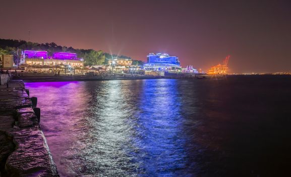 ODESSA, UKRAINE - 08.22.2018. Panoramic view of Langeron city beach in a hot summer night. The most popular beach in Odessa