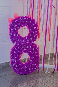Number eight decor from tissue paper on birthday party