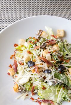 Caesar salad with bacon and chicken, mediterranean cuisine