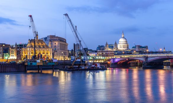 Panoramic of St paul cathedral with river thames sunset twilight in London UK. 