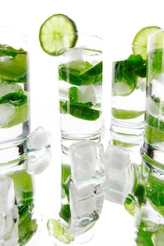 Party mojito cocktails with lime and mint isolated on white background