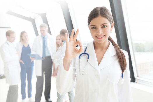 Young female doctor and medical team in hospital