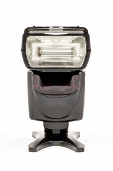 Front view of a black unbranded external flash unit for DSLR camera