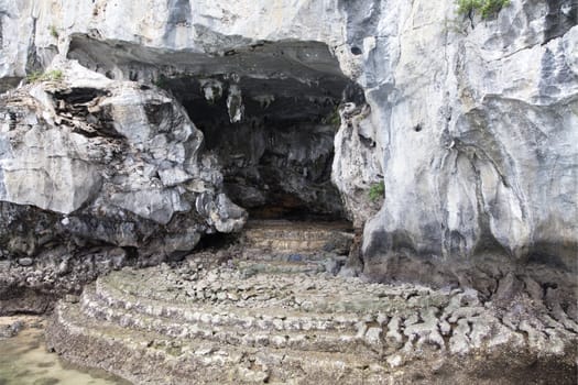 Entrance in a sea cave at Ha Long bay, Vietnam