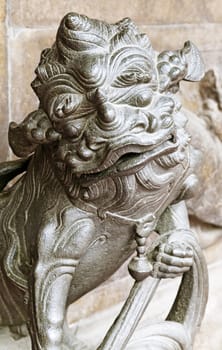 Marble lion at the entrance of a temple, Vietnam